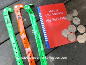 Plastic wristlet and Curio Coins from Port of Lost Wonders